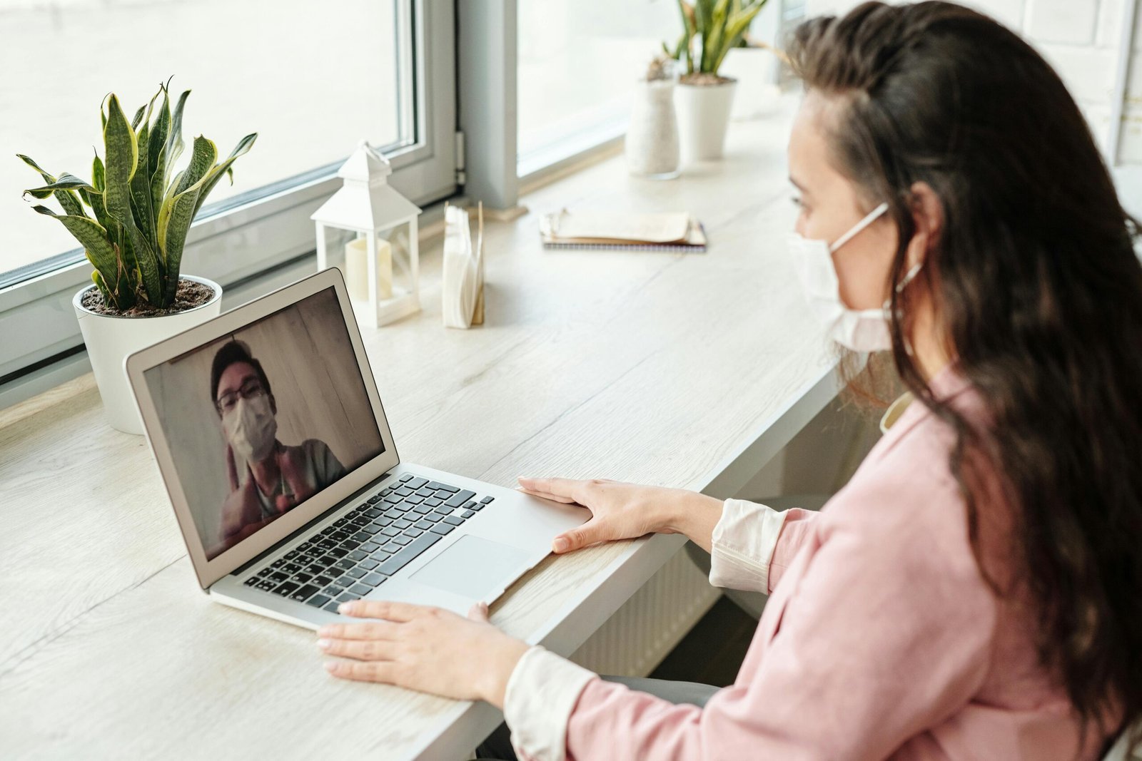 Patient having a video consultation with a GP on a laptop